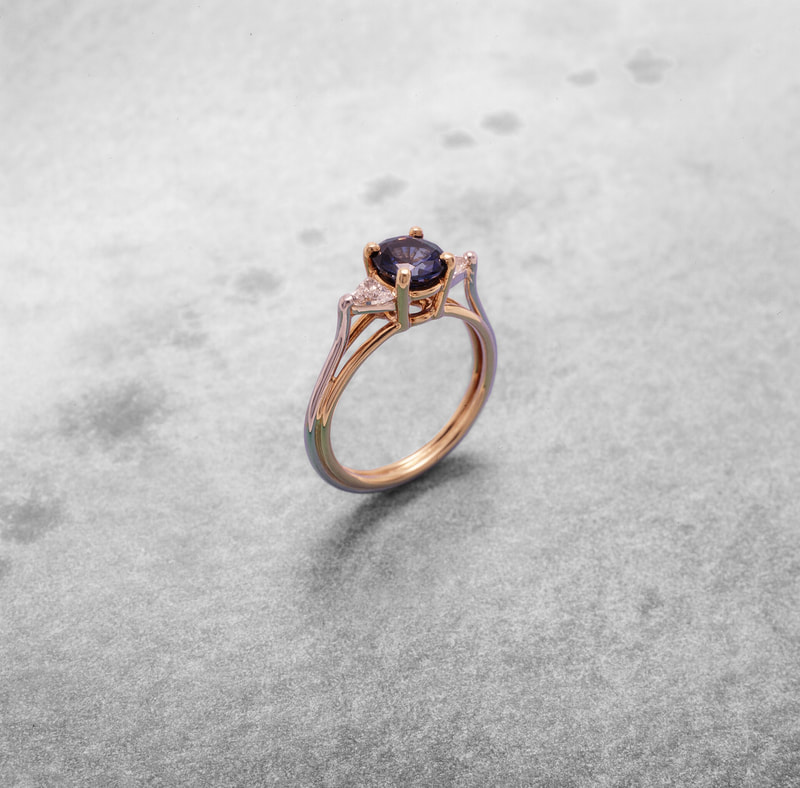 Gold ring with purple sapphire and diamonds